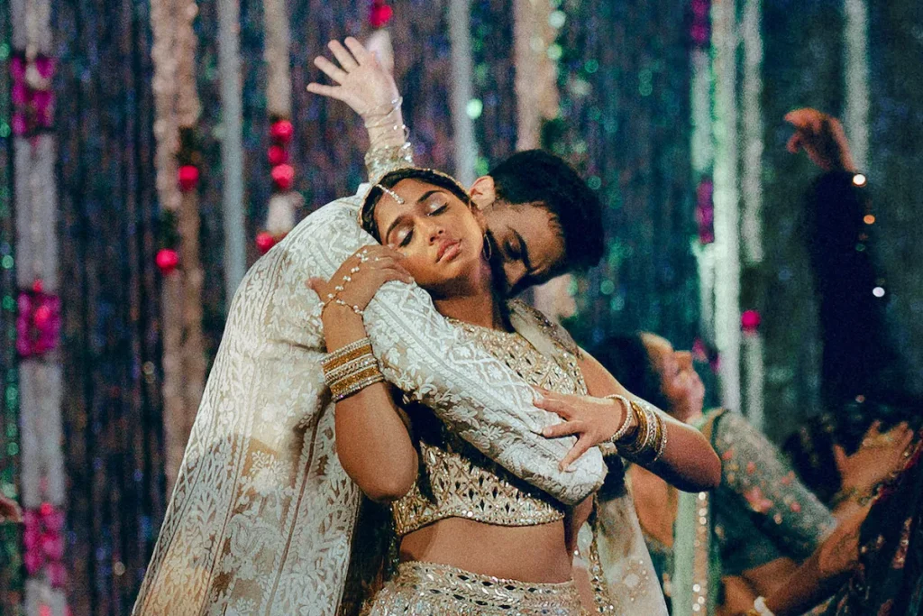 Two dancers hold a dramatic lift during a formal performance in Best of the Best