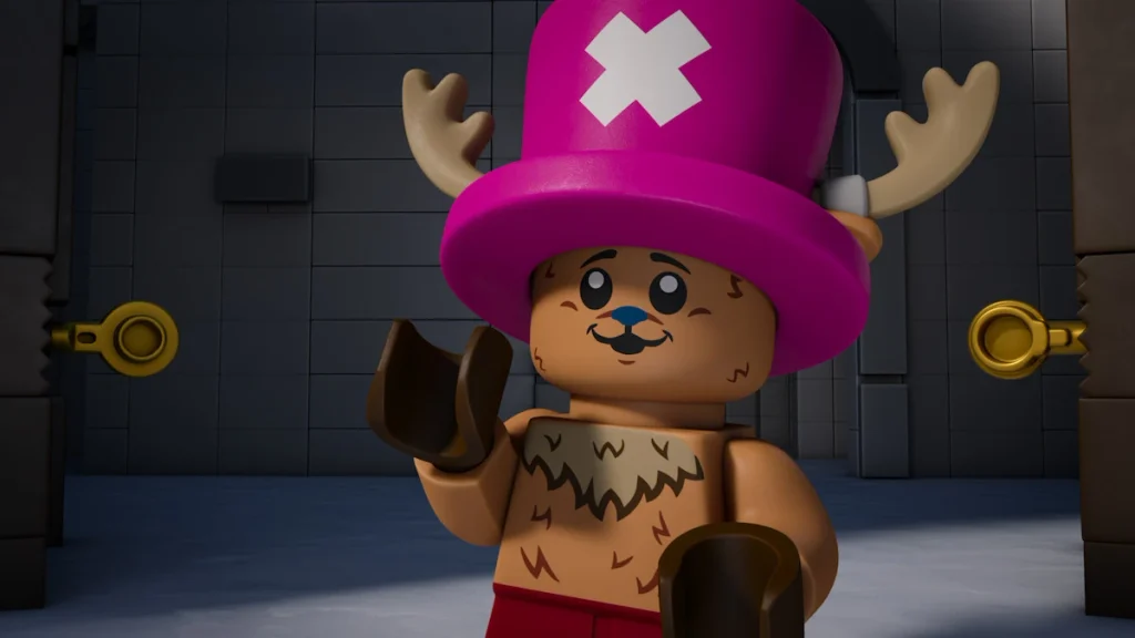 A LEGO figure of Chopper wears a pink hat marked with a white X inside a gray brick room