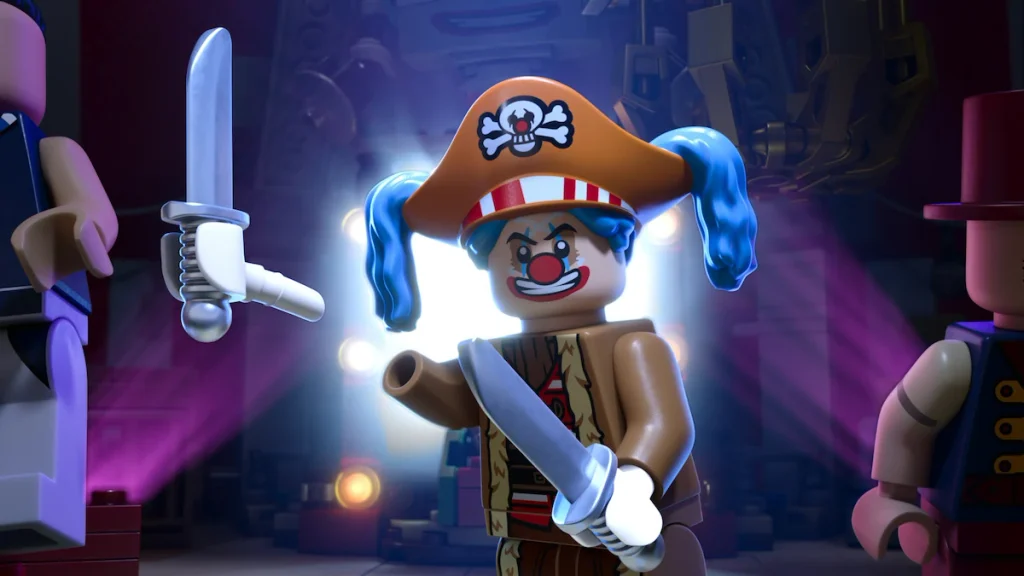 A blue-haired LEGO clown pirate holds a sword on a lit stage, flanked by other figures