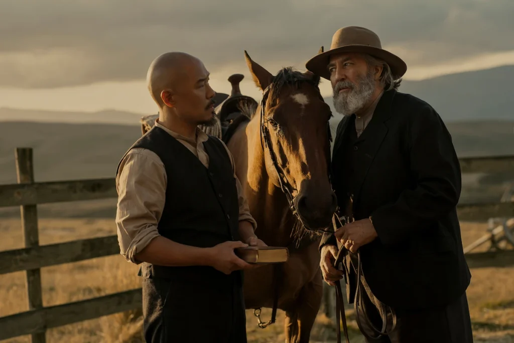 Lee holds a book beside Samuel and a horse in East of Eden.