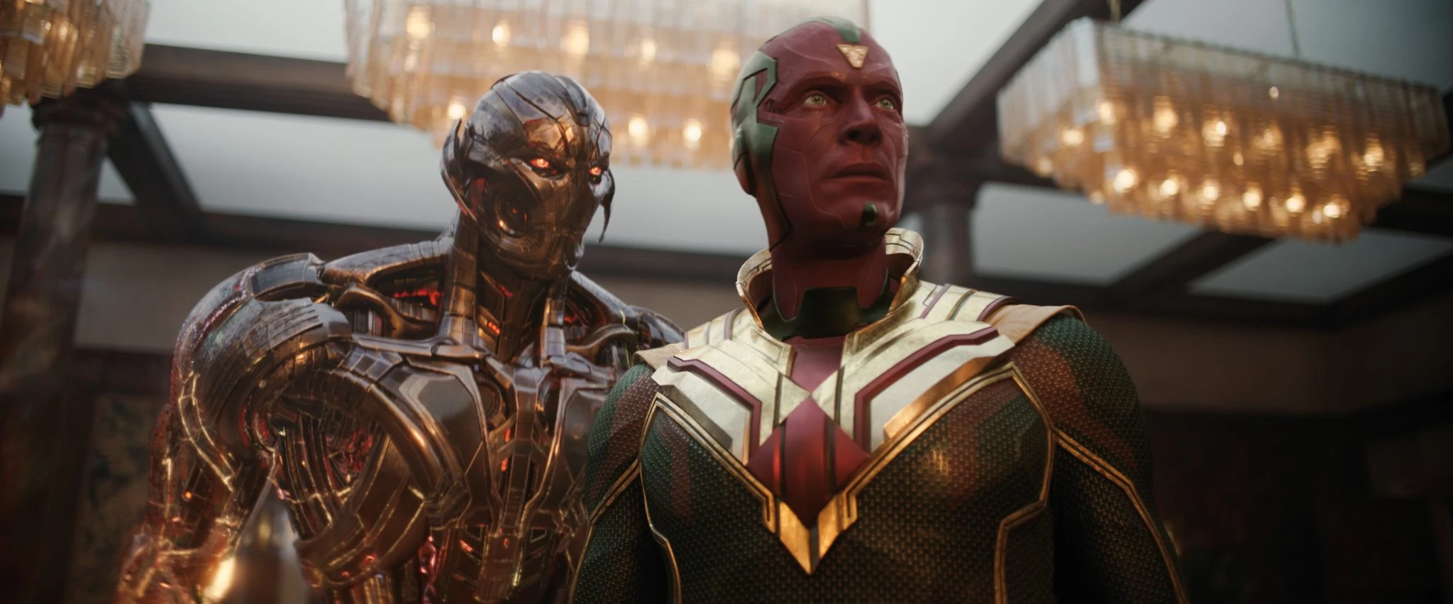 Ultron stands behind Vision beneath chandeliers in VisionQuest